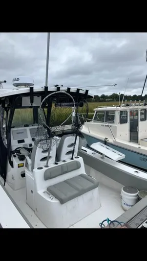  Yacht Photos Pics 2023 Cape Horn 27 XS boat docked with fishing gear and seating.