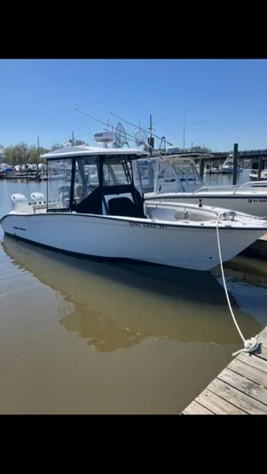  Yacht Photos Pics 2023 Cape Horn 27 XS boat docked in a marina under clear blue skies.