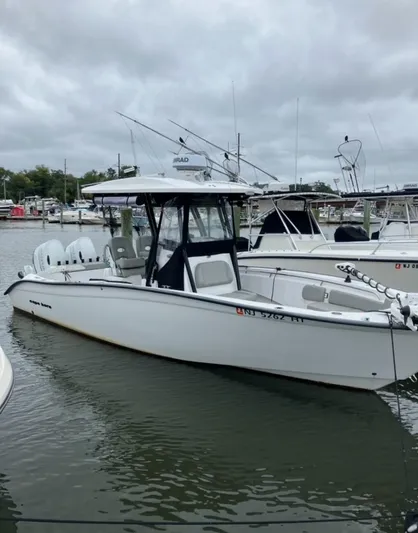  Yacht Photos Pics 2023 Cape Horn 27 XS boat docked in a marina under cloudy skies.