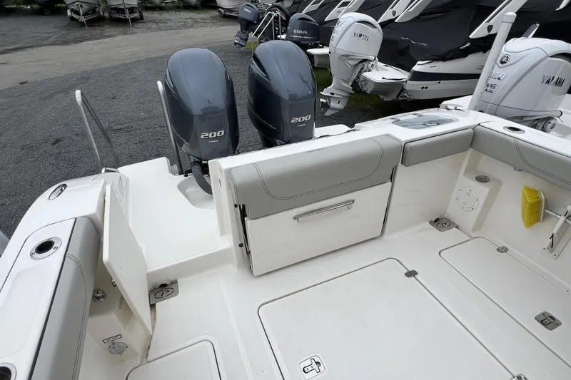 Happy Hours Yacht Photos Pics 2023 Pursuit S 268 Sport boat with twin Yamaha 200 engines, spacious deck layout.