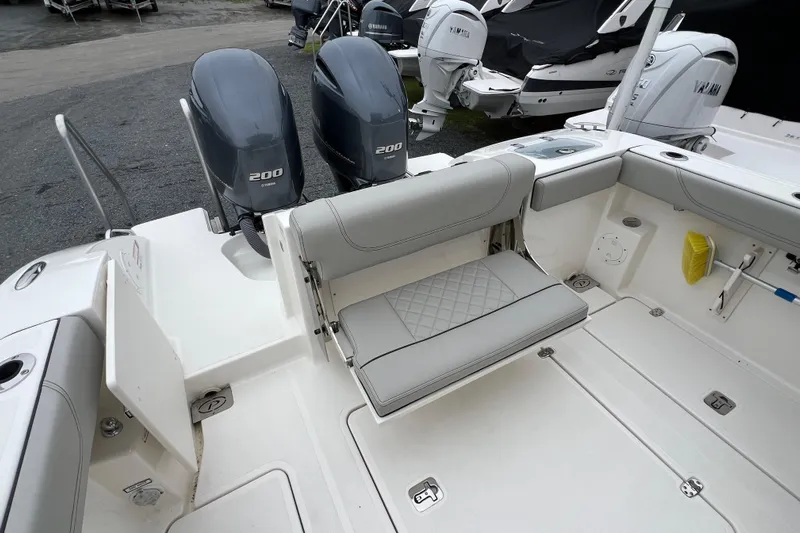 Happy Hours Yacht Photos Pics 2023 Pursuit S 268 Sport boat with dual Yamaha 200 engines and spacious seating area.