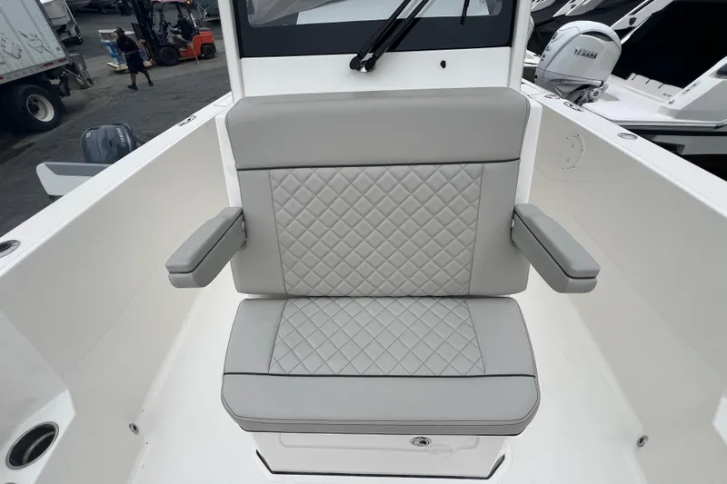 Happy Hours Yacht Photos Pics 2023 Pursuit S 268 Sport boat seat with quilted gray upholstery and armrests.