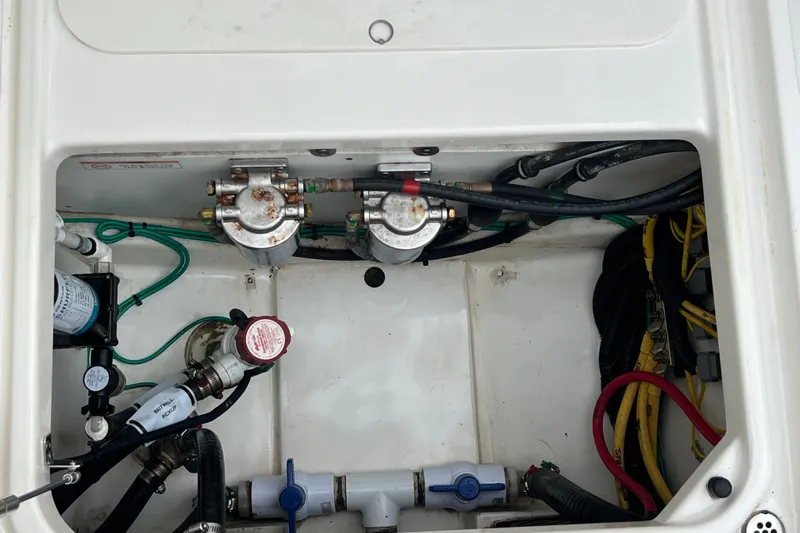Happy Hours Yacht Photos Pics 2023 Pursuit S 268 Sport boat engine compartment with wiring and components.