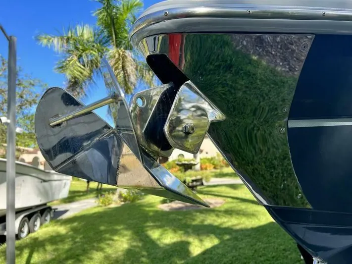  Yacht Photos Pics Close-up of a 1996 Formula 382 SR1 boat anchor with palm trees in the background.