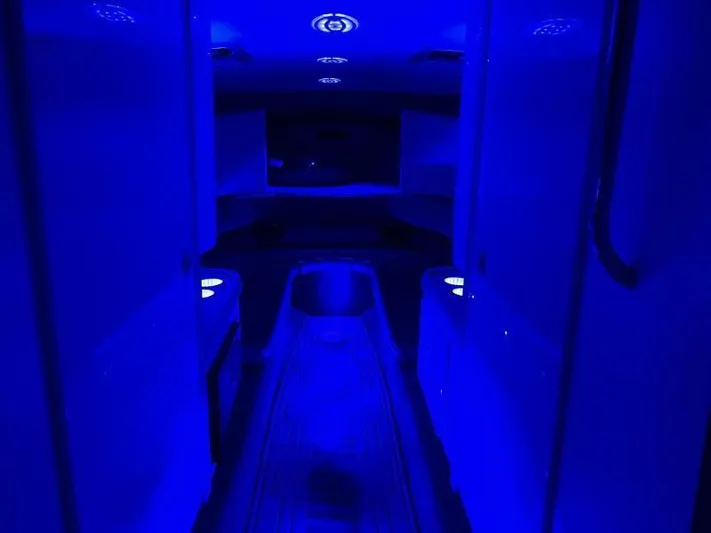  Yacht Photos Pics Interior of a 1996 Formula 382 SR1 boat with blue ambient lighting.
