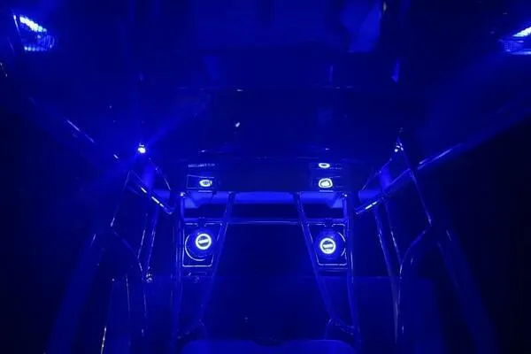  Yacht Photos Pics Blue-lit interior of a 1996 Formula 382 SR1 boat, showcasing sleek design and modern lighting.