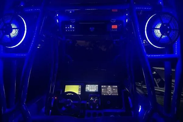  Yacht Photos Pics 1996 Formula 382 SR1 boat cockpit illuminated with blue LED lights at night.