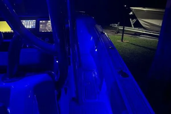  Yacht Photos Pics 1996 Formula 382 SR1 boat interior with blue LED lighting at night.