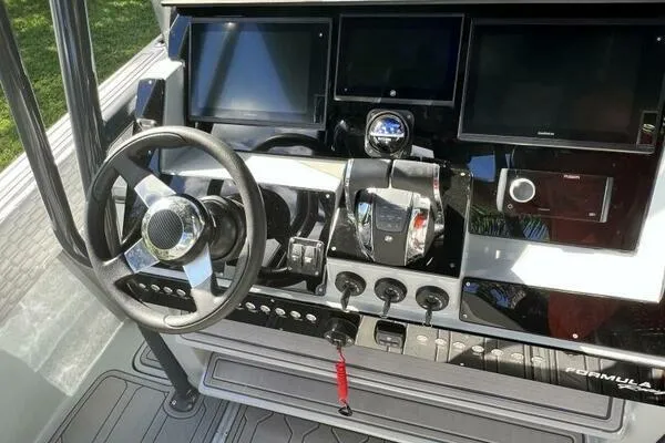  Yacht Photos Pics 1996 Formula 382 SR1 boat dashboard with steering wheel and control panels.
