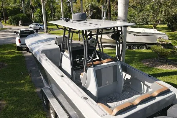  Yacht Photos Pics 1996 Formula 382 SR1 boat on trailer, parked outdoors with lush greenery.