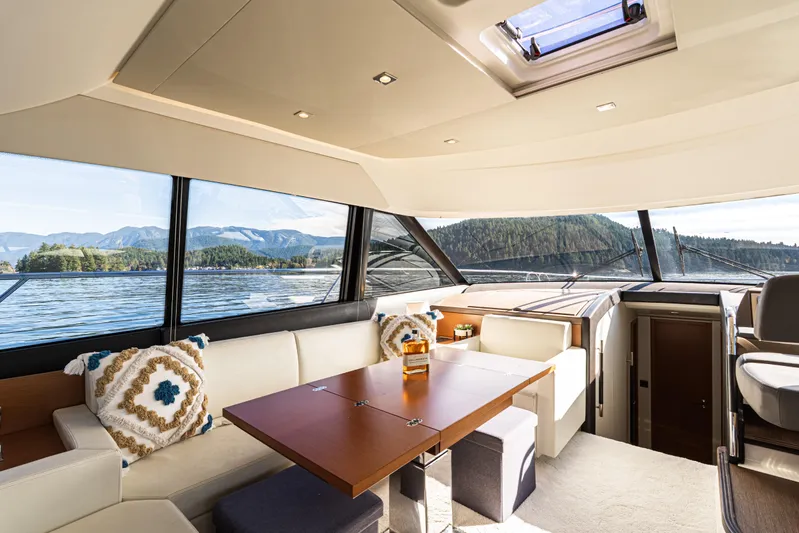 Luna Maris Yacht Photos Pics Luxurious interior of 2016 Prestige 550 Flybridge yacht with scenic water views.