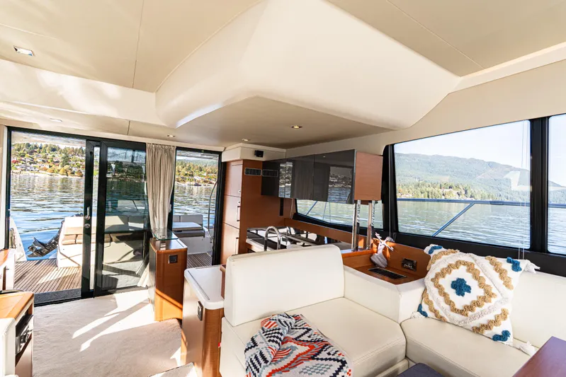 Luna Maris Yacht Photos Pics Luxurious interior of 2016 Prestige 550 Flybridge yacht with scenic water views.