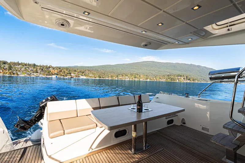 Luna Maris Yacht Photos Pics Luxury 2016 Prestige 550 Flybridge yacht with scenic lake and mountain view.