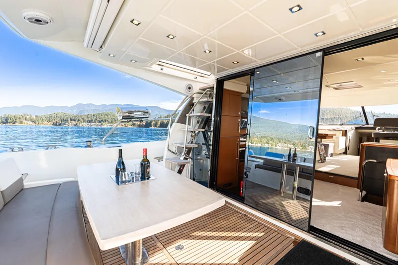 Luna Maris Yacht Photos Pics Luxurious 2016 Prestige 550 Flybridge yacht interior with scenic lake and mountain views.