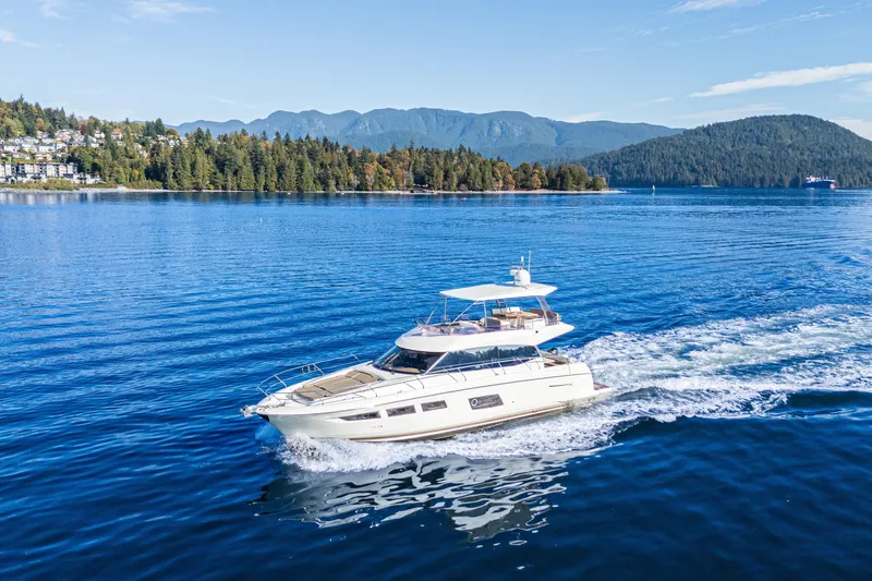 Luna Maris Yacht Photos Pics Luxury 2016 Prestige 550 Flybridge yacht cruising on scenic blue waters.