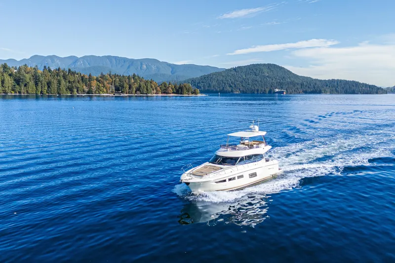 Luna Maris Yacht Photos Pics Luxury 2016 Prestige 550 Flybridge yacht cruising on scenic blue waters.