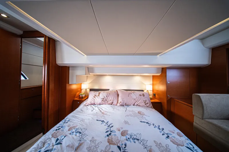 Luna Maris Yacht Photos Pics Luxurious bedroom interior of 2016 Prestige 550 Flybridge yacht with elegant bedding.
