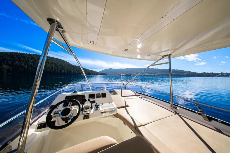 Luna Maris Yacht Photos Pics Luxurious 2016 Prestige 550 Flybridge yacht interior with scenic lake view.