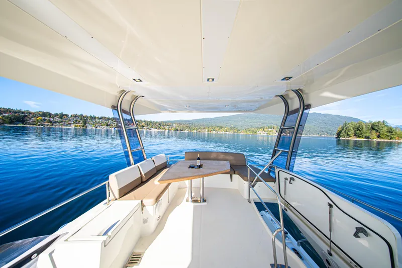 Luna Maris Yacht Photos Pics Flybridge of 2016 Prestige 550 yacht with scenic lake and mountain views.