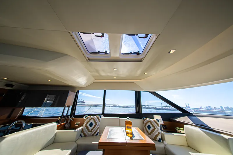 Luna Maris Yacht Photos Pics Luxurious interior of 2016 Prestige 550 Flybridge yacht with scenic ocean view.