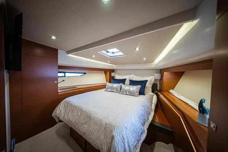 Luna Maris Yacht Photos Pics Luxurious bedroom interior of 2016 Prestige 550 Flybridge yacht with elegant bedding.