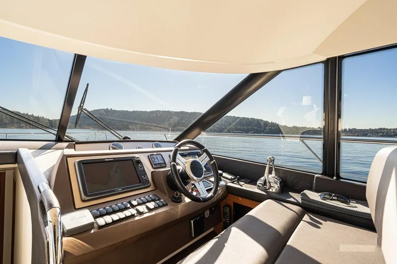 Luna Maris Yacht Photos Pics Luxurious 2016 Prestige 550 Flybridge yacht helm with panoramic water views.