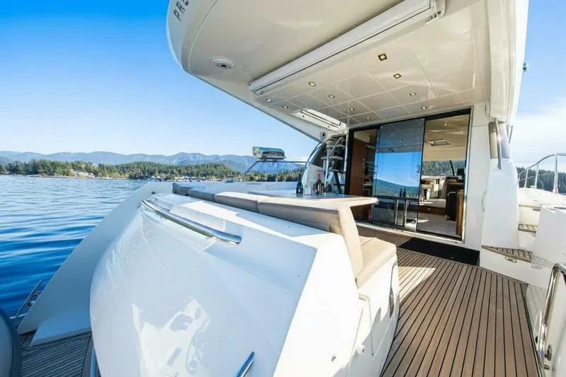 Luna Maris Yacht Photos Pics 2016 Prestige 550 Flybridge yacht with elegant deck and scenic water view.