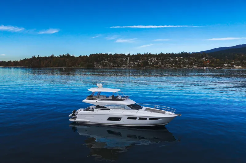 Luna Maris Yacht Photos Pics Luxurious 2016 Prestige 550 yacht cruising on serene blue waters.