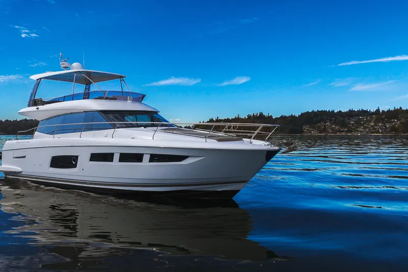 Luna Maris Yacht Photos Pics Luxury 2016 Prestige 550 yacht cruising on serene blue waters under clear skies.