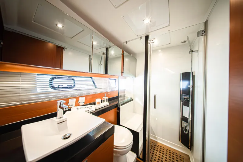 Luna Maris Yacht Photos Pics Luxurious bathroom in 2016 Prestige 550 yacht with modern fixtures and elegant design.