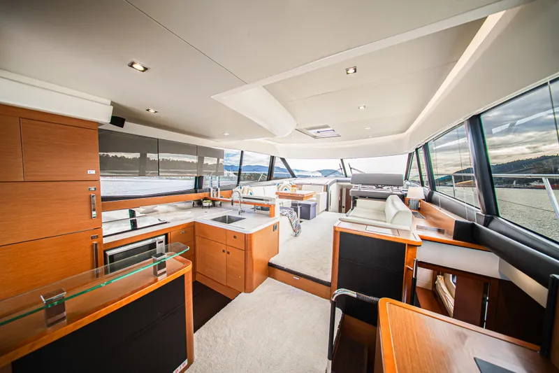 Luna Maris Yacht Photos Pics Luxurious interior of 2016 Prestige 550 yacht with modern kitchen and panoramic windows.