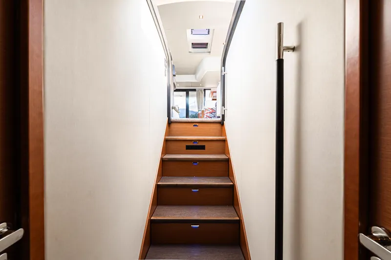 Luna Maris Yacht Photos Pics Staircase inside 2016 Prestige 550 yacht, leading to upper deck with modern design.
