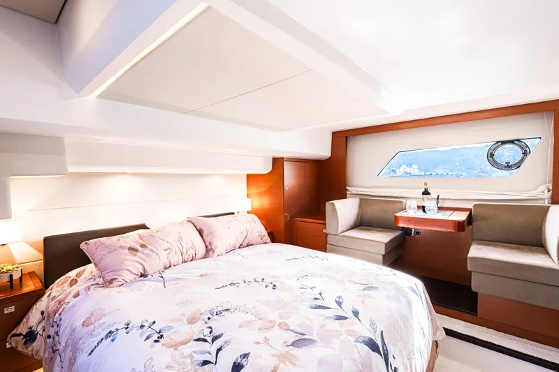 Luna Maris Yacht Photos Pics Luxurious 2016 Prestige 550 yacht bedroom with elegant decor and scenic window view.