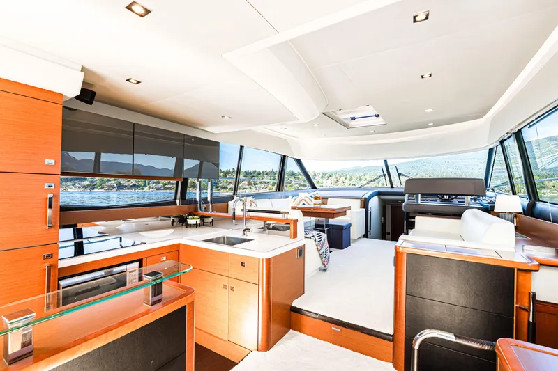 Luna Maris Yacht Photos Pics Luxurious interior of 2016 Prestige 550 yacht with modern kitchen and panoramic windows.