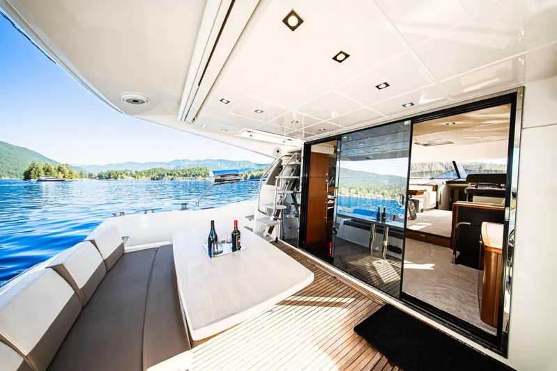 Luna Maris Yacht Photos Pics Luxurious 2016 Prestige 550 yacht interior with scenic lake view and elegant seating area.