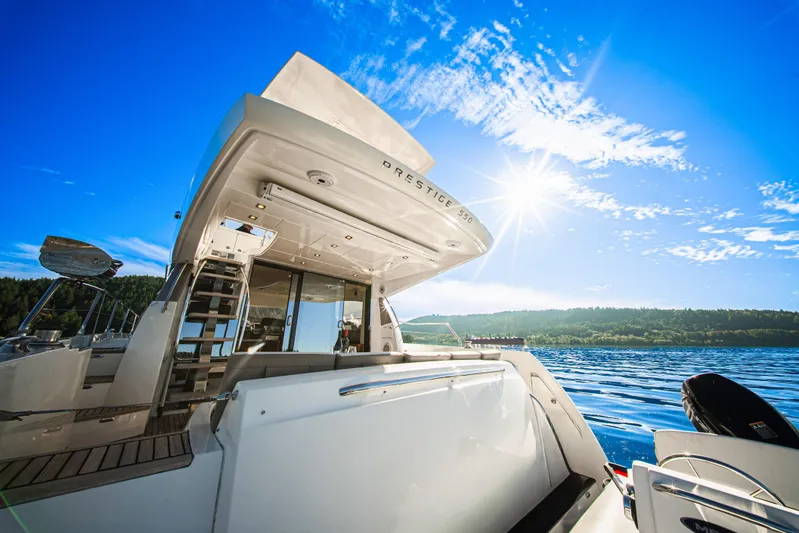 Luna Maris Yacht Photos Pics Luxury 2016 Prestige 550 yacht on clear blue water under sunny sky.