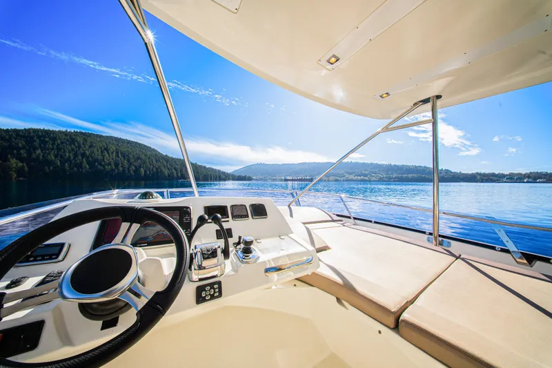 Luna Maris Yacht Photos Pics Luxurious 2016 Prestige 550 yacht interior with scenic ocean view and clear blue sky.