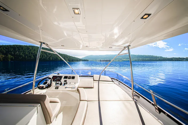 Luna Maris Yacht Photos Pics Luxurious 2016 Prestige 550 yacht interior with scenic lake view and clear blue skies.