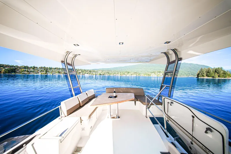 Luna Maris Yacht Photos Pics Luxury yacht deck view on serene lake, Prestige 550, 2016 model.