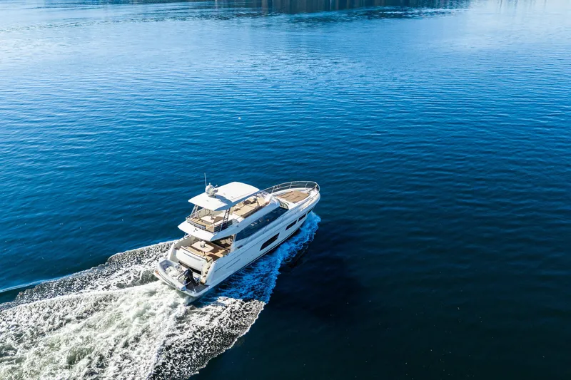 Luna Maris Yacht Photos Pics Luxury 2016 Prestige 550 yacht cruising on calm blue waters.