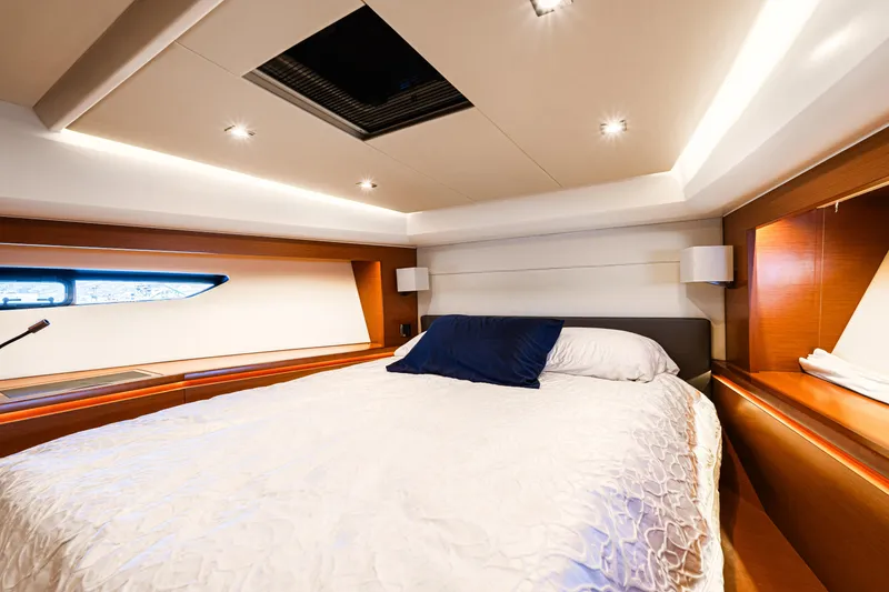 Luna Maris Yacht Photos Pics Luxurious bedroom interior of 2016 Prestige 550 yacht with modern lighting and elegant bedding.
