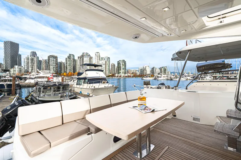 Luna Maris Yacht Photos Pics Luxurious 2016 Prestige 550 yacht docked with city skyline view.