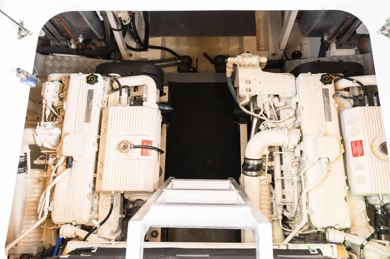 Luna Maris Yacht Photos Pics Engine room of a 2016 Prestige 550 yacht, featuring dual engines and mechanical components.