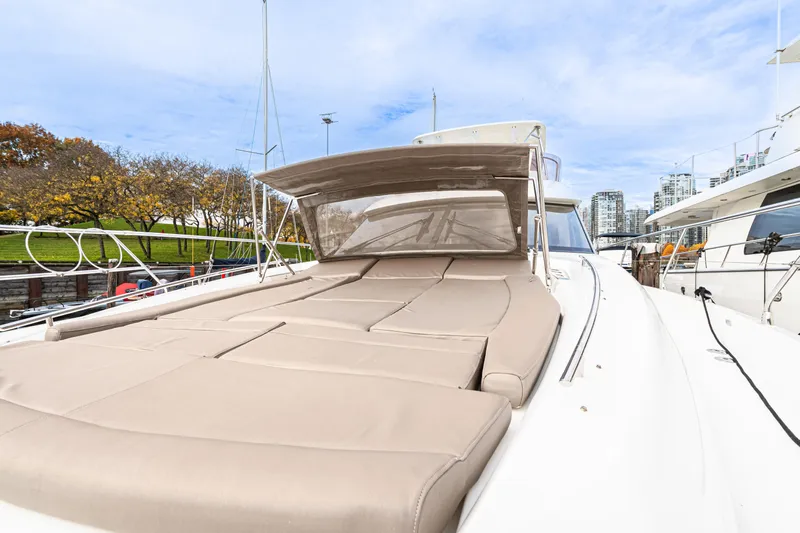 Luna Maris Yacht Photos Pics Prestige 550 yacht, 2016 model, featuring spacious sunbathing deck, docked in marina.