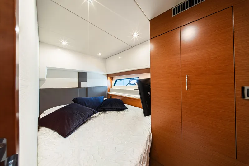 Luna Maris Yacht Photos Pics Luxurious cabin interior of a 2016 Prestige 550 yacht with modern wood finishes.