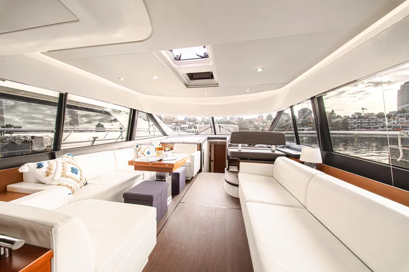 Luna Maris Yacht Photos Pics Luxurious interior of 2016 Prestige 550 yacht with elegant seating and panoramic windows.