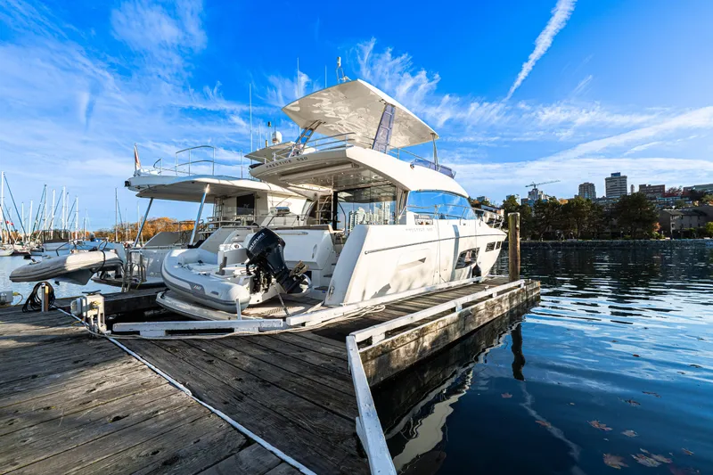 Luna Maris Yacht Photos Pics Luxury 2016 Prestige 550 yacht docked at marina under clear blue sky.