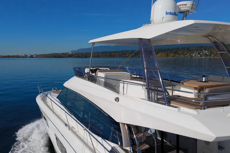 Luna Maris Yacht Photos Pics Luxury 2016 Prestige 550 yacht cruising on calm waters, showcasing sleek design and spacious deck.