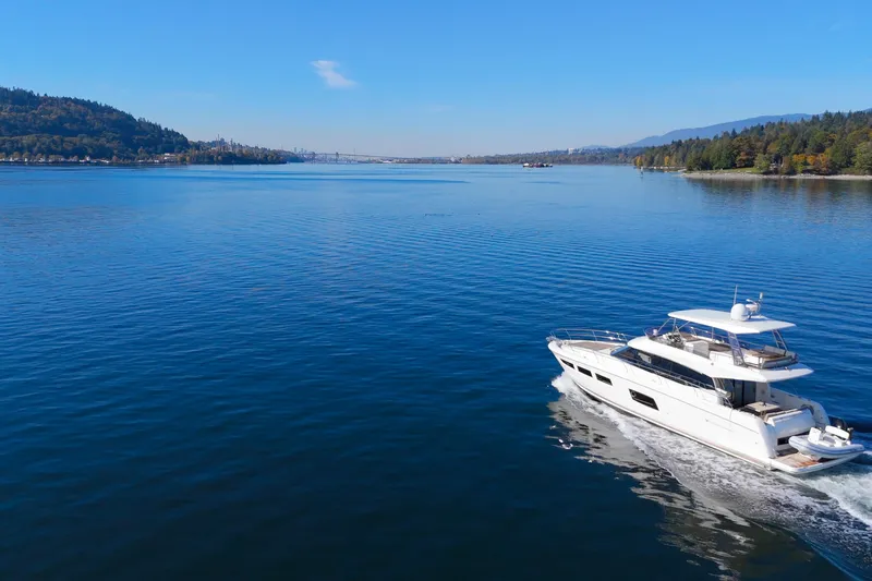 Luna Maris Yacht Photos Pics Luxury 2016 Prestige 550 yacht cruising on serene blue waters under clear skies.