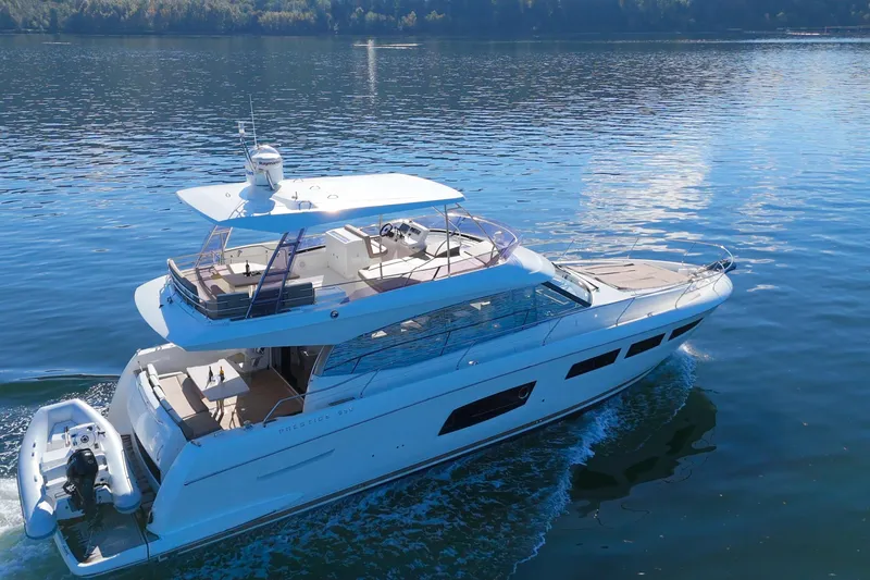 Luna Maris Yacht Photos Pics Luxurious 2016 Prestige 550 yacht cruising on serene waters.